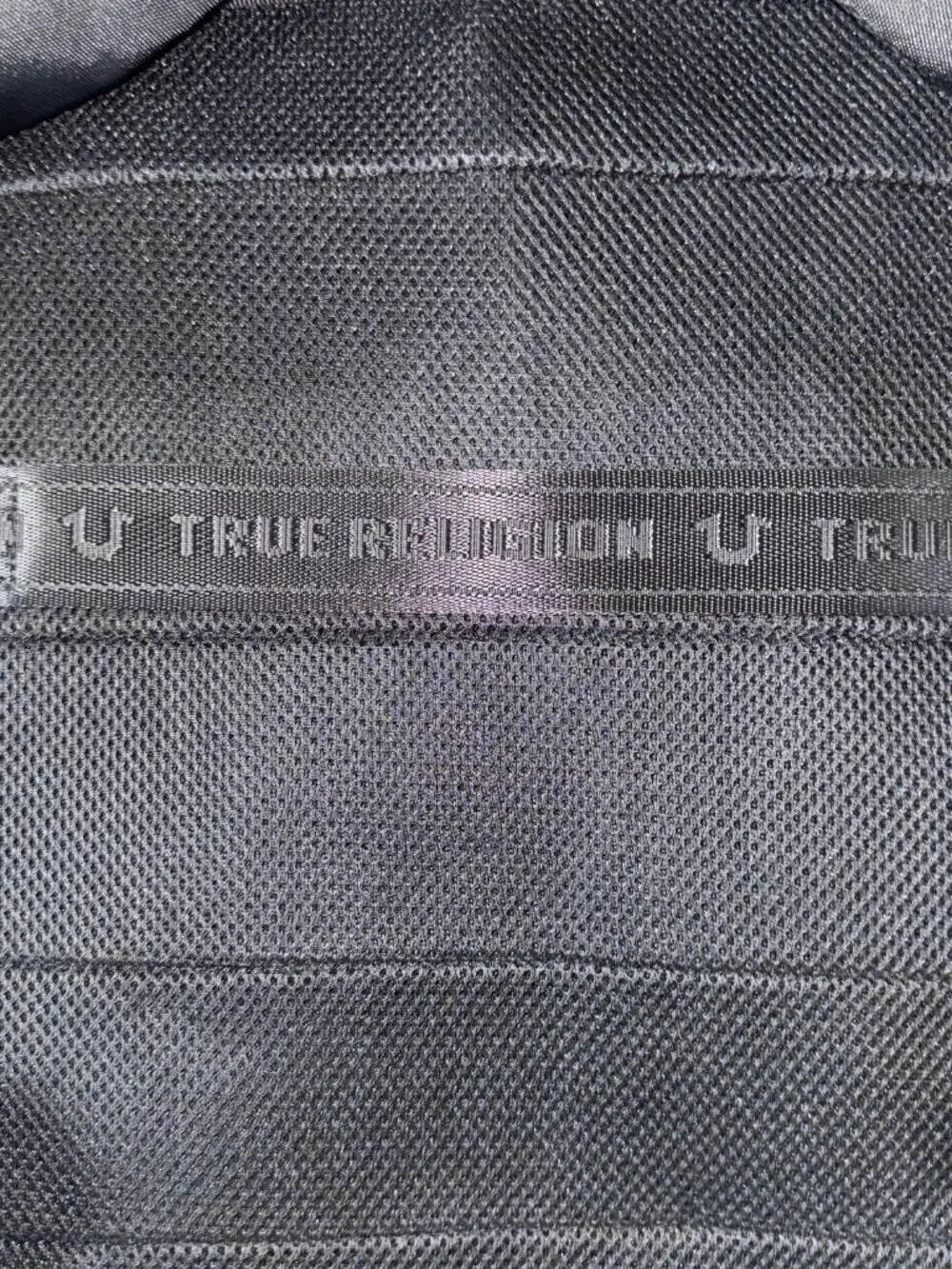 True Religion Will travel backpack in black with a volume of 23 l